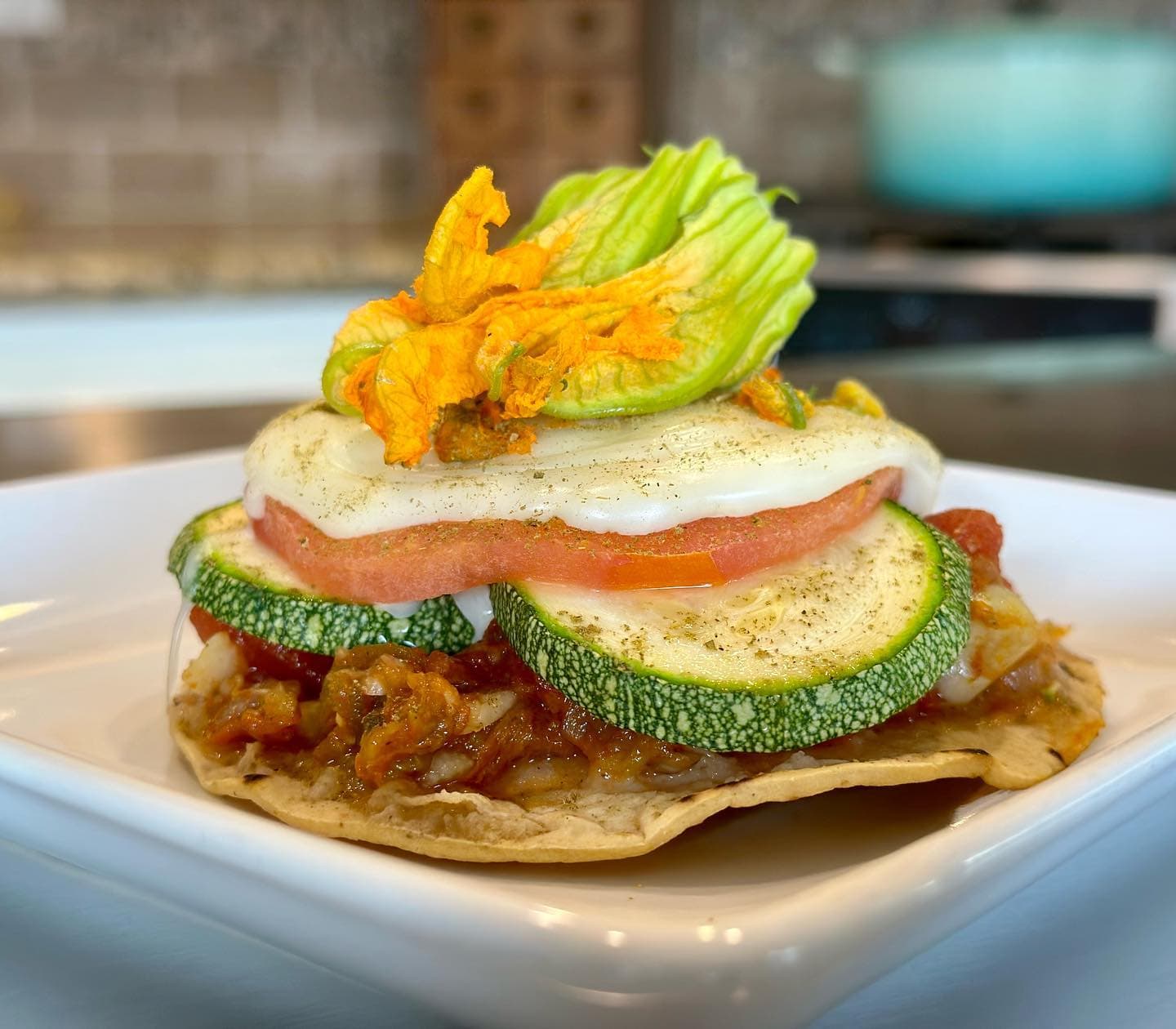 Squash Blossom Tostada with Oaxaca cheese